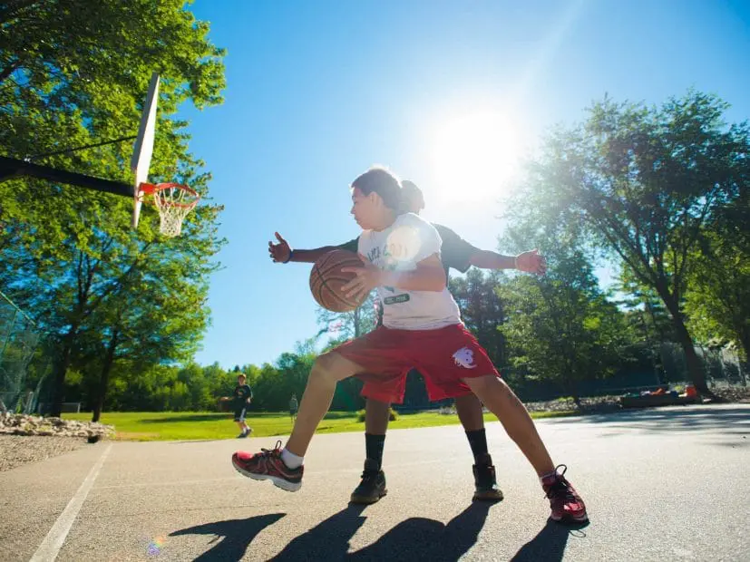 two boys playing basketball