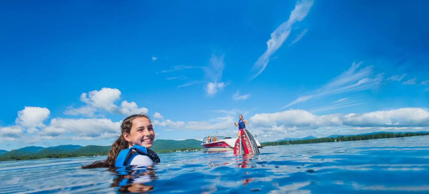 a girl smiling while in the water