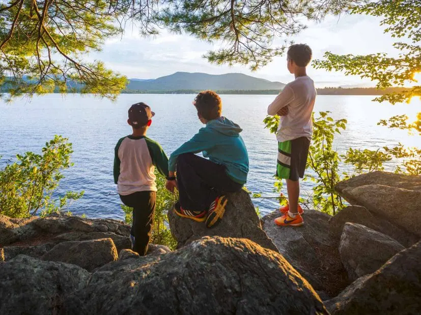 boys looking out over a lake