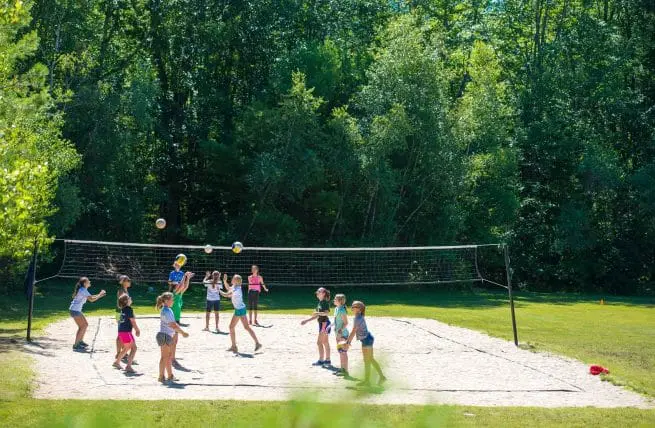 girls playing beach volleyball