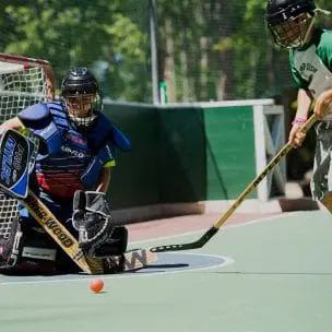 boys playing street hockey