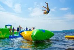 kid flying through the air into the lake