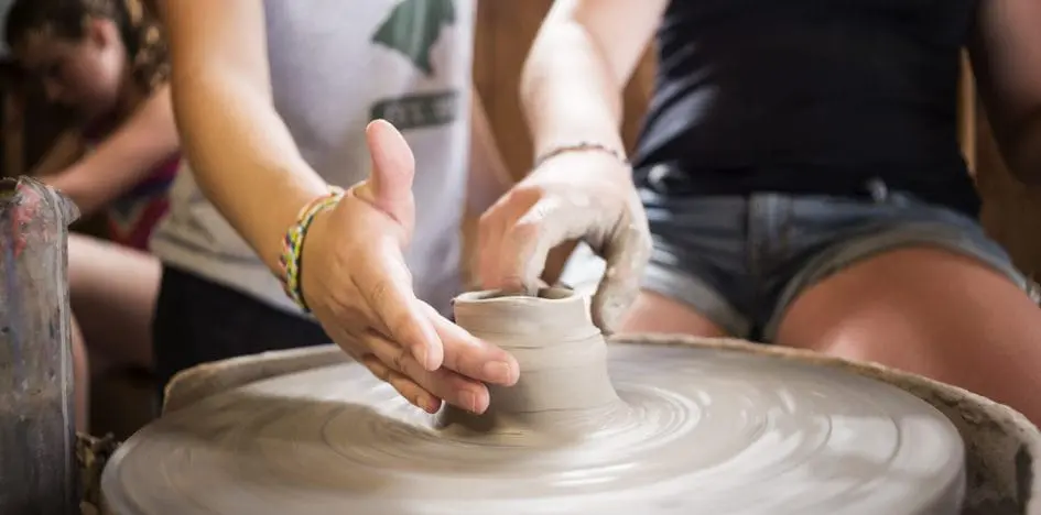 kids sculpting pottery