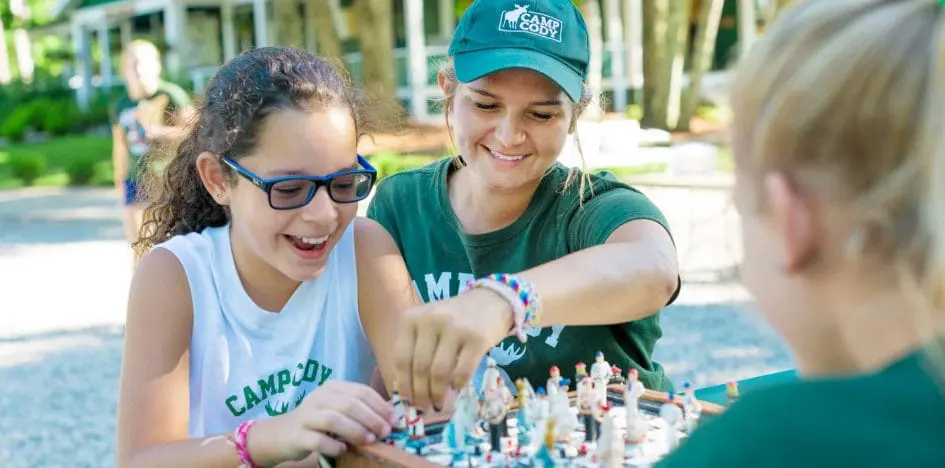 girls having fun playing chess