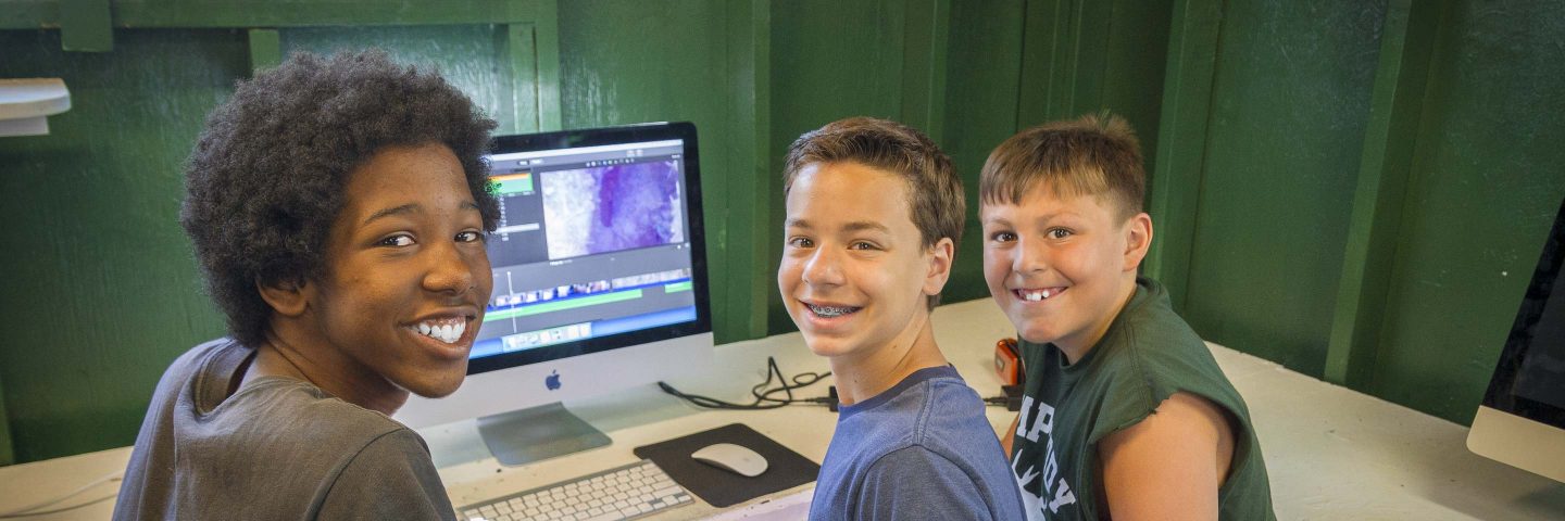 boys using computer at summer camp