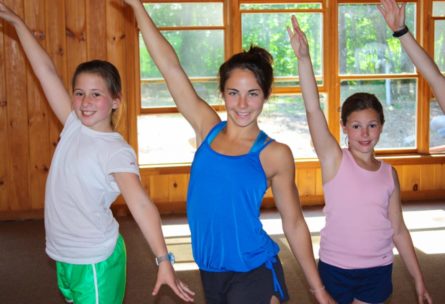 three young girls dancing