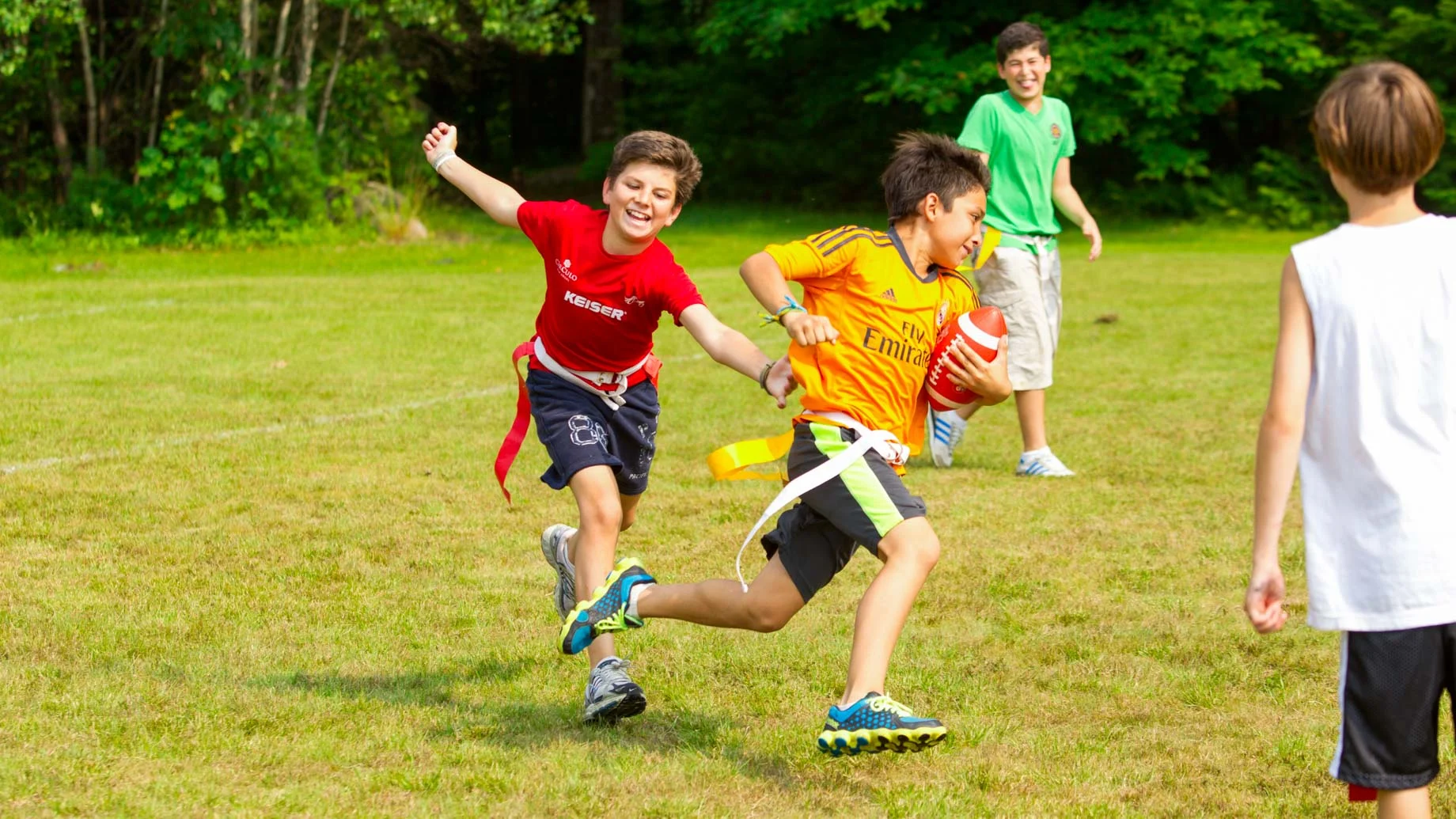 boys playing flag football