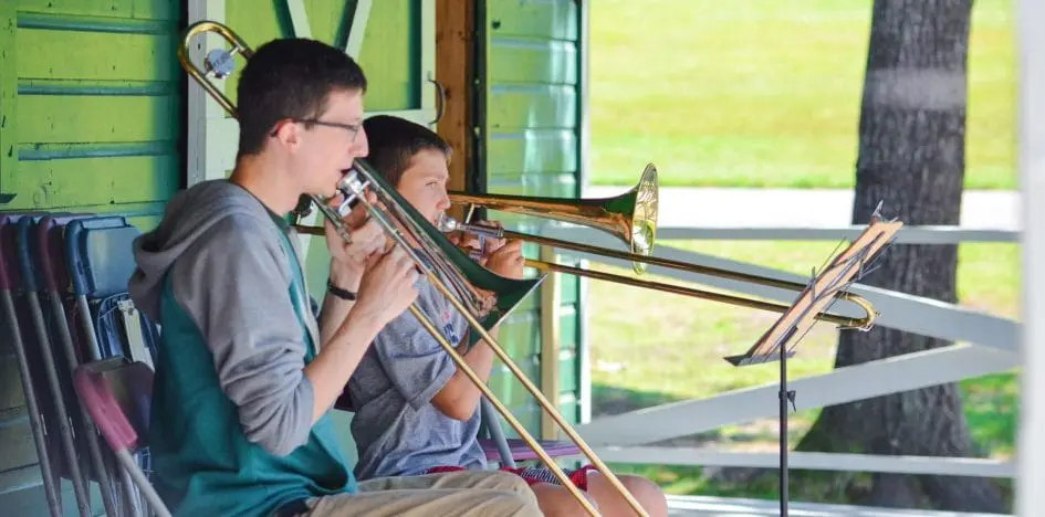 two kids playing trumpets