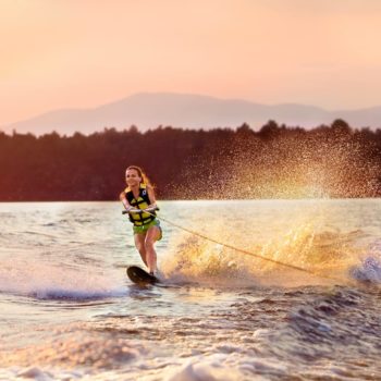 a young girl wakeboarding