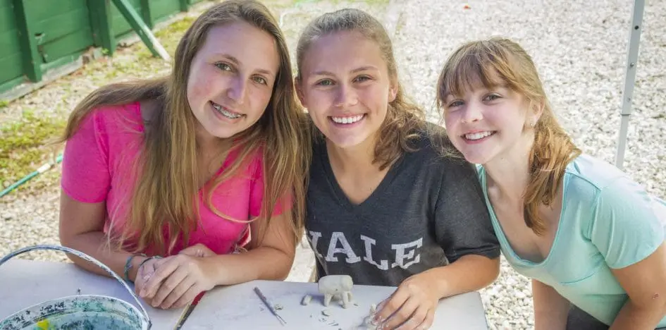 three girls smiling