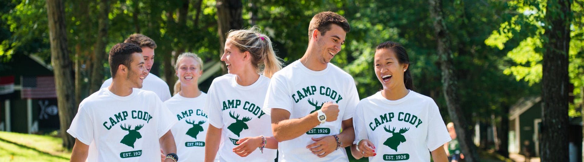 a group of counselors walking together and smiling