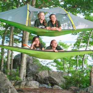 girls relaxing in the air in hammocks
