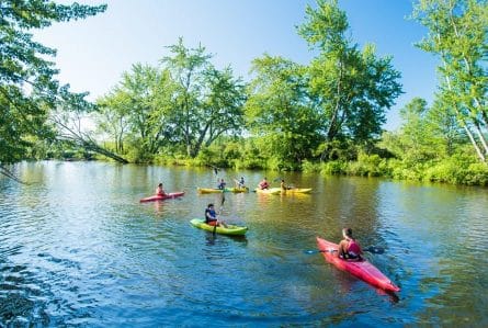 kids kayaking at summer camp