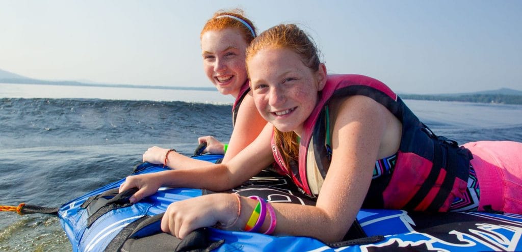 girls about to go tubing in ocean