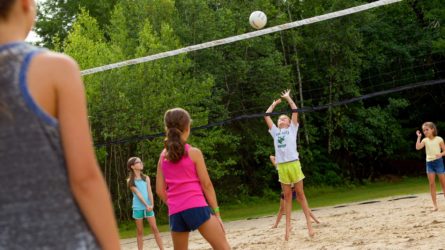 campers with awful form trying to set a volleyball