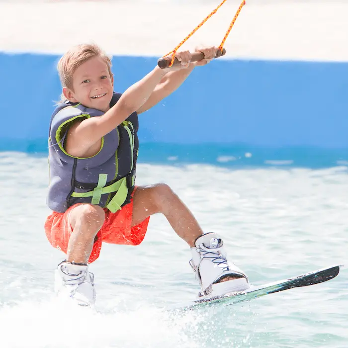 young boy wakeboarding