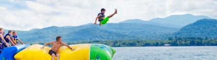 young boy on the blob at camp cody