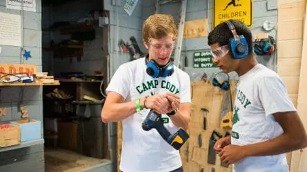 boys playing with an electric screwdriver