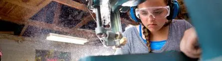 girl focusing on woodworking