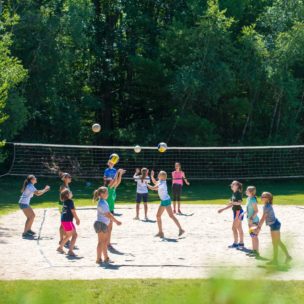 campers trying to play outdoor volleyball