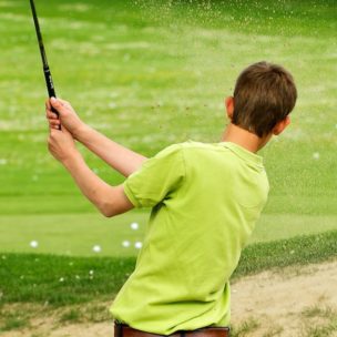 boy golfing