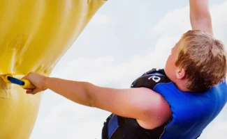 boy holding the handles of a wibit