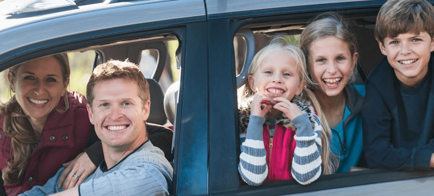 family driving and looking out window