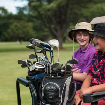 two boys playing golf.