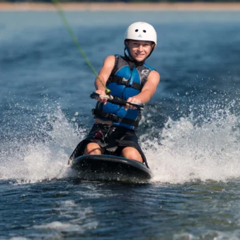 boy kneeboarding.