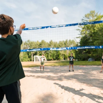 kids playing sand volleyball.