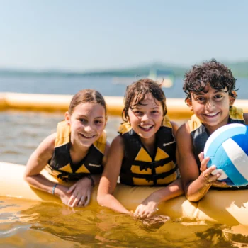 kids on water volleyball court.
