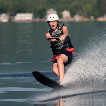 boy waterskiing.